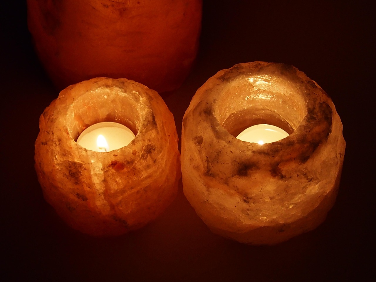 A Himalayan salt lamp glowing warm amber